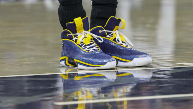Orlando Magic center Moritz Wagner's navy and maize Air Jordan sneakers.